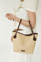 LEATHER-TRIMMED RAFFIA BUCKET BAG