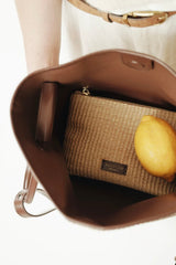 LEATHER-TRIMMED RAFFIA BUCKET BAG