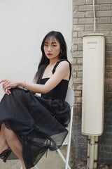 SLEEVELESS PLEATED DRESS