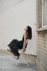 SLEEVELESS PLEATED DRESS