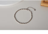 WHITE GOLD/ 18K GOLD CROP-SHAPED BRACELET